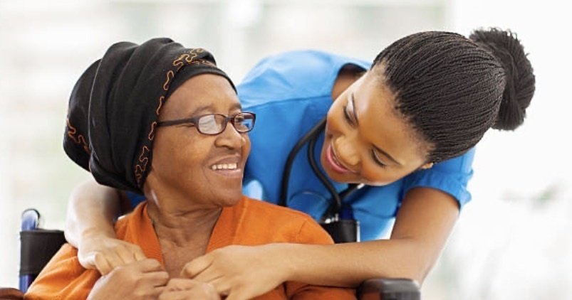 Professional caregiver providing compassionate in-home care for a senior client in Indiana
